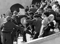 Opposition supporters clash with police in Baku, October 2003, after Ilham Aliyev was declared winner of the presidential election.